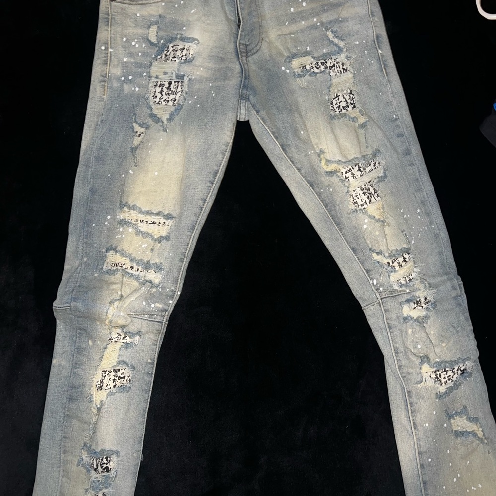Grind house denim jeans stacked